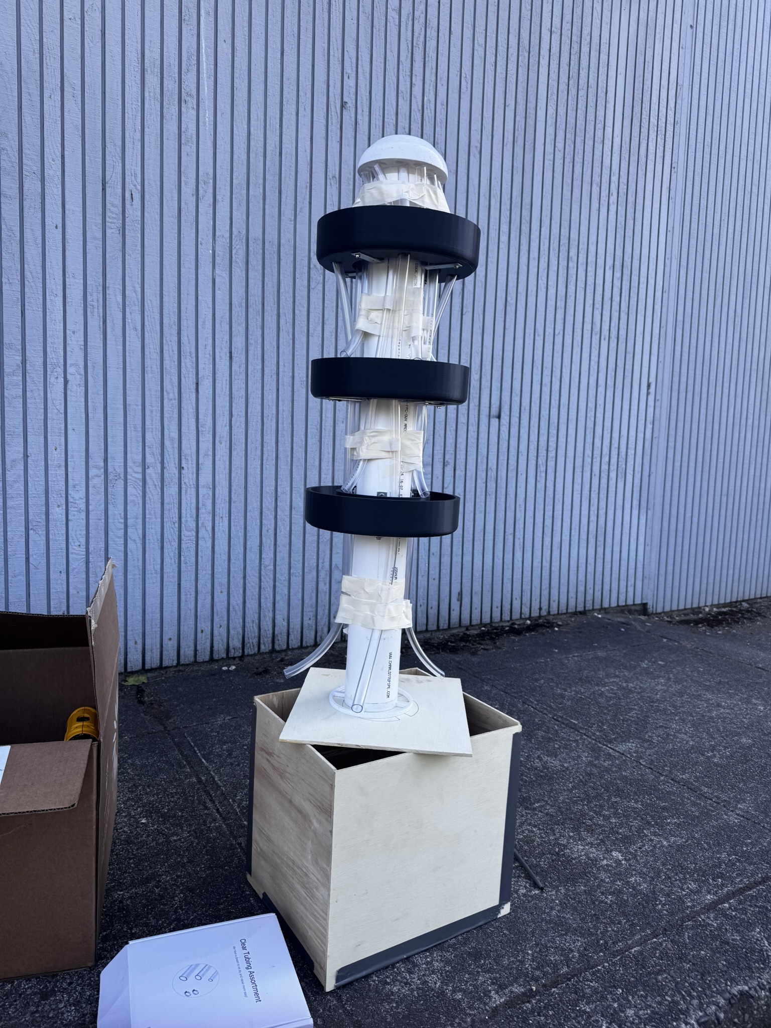 Fully assembled solar irrigation tower undergoing assembly